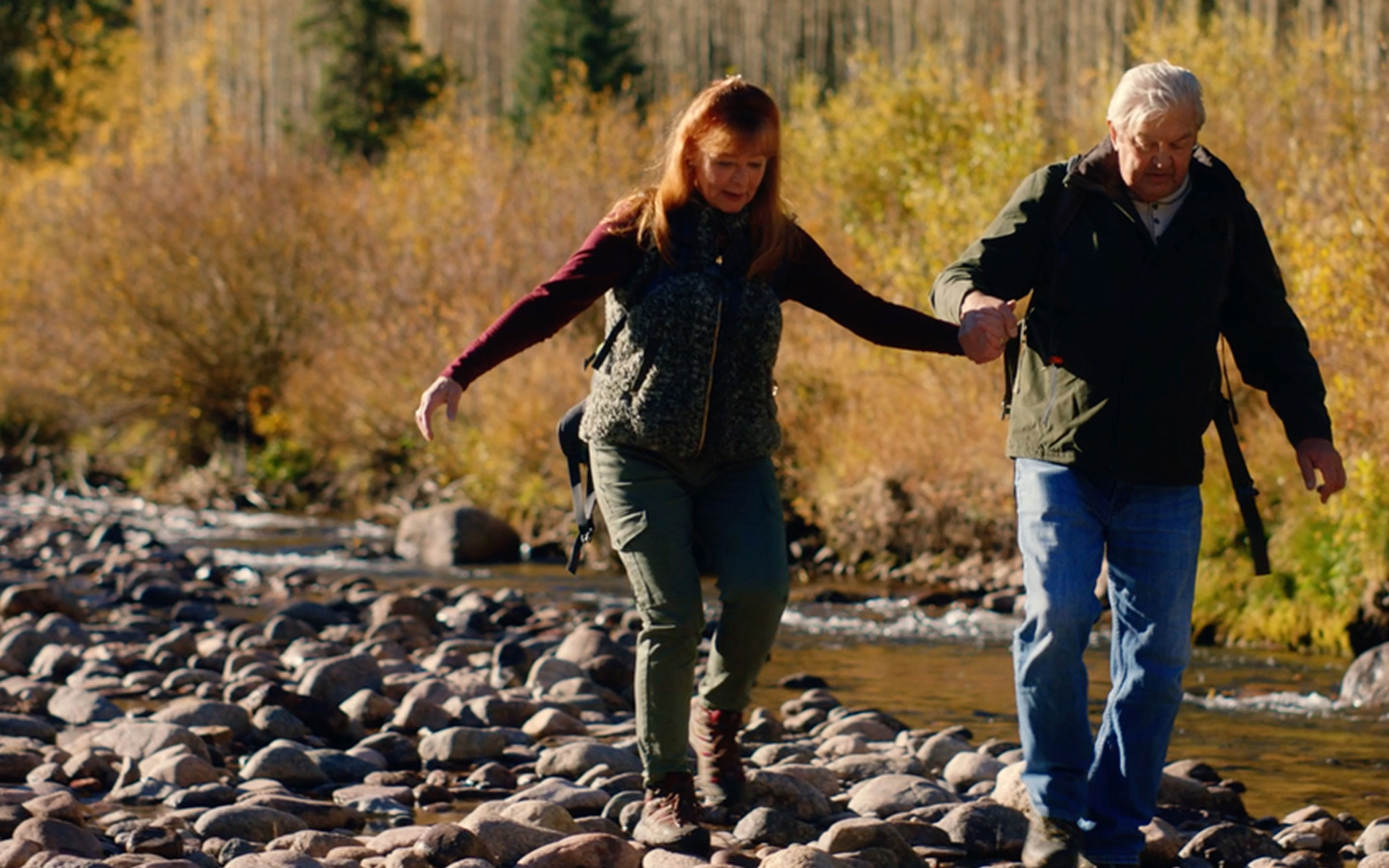 Couple hiking and holding hands
