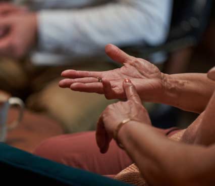 Dupuytren’s contracture patient with left hand rubbing open right palm