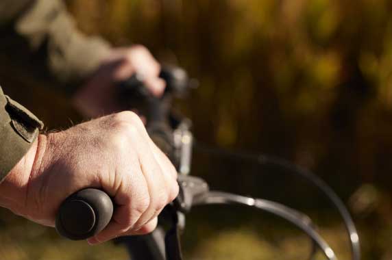 Picture of hands holding bicycle handle bars