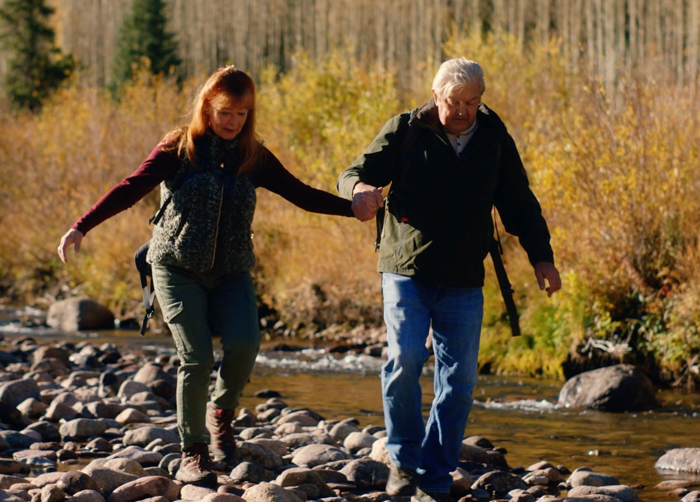 Couple hiking and holding hands